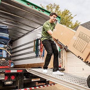 Little Guy unloading a u-haul truck