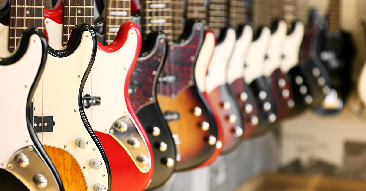 Several electric guitars hanging on display