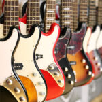 Several electric guitars hanging on display