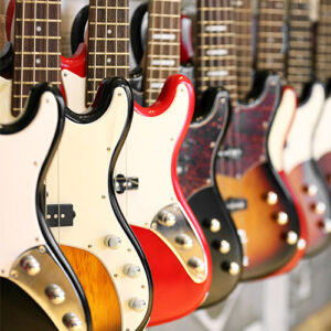 Several electric guitars hanging on display
