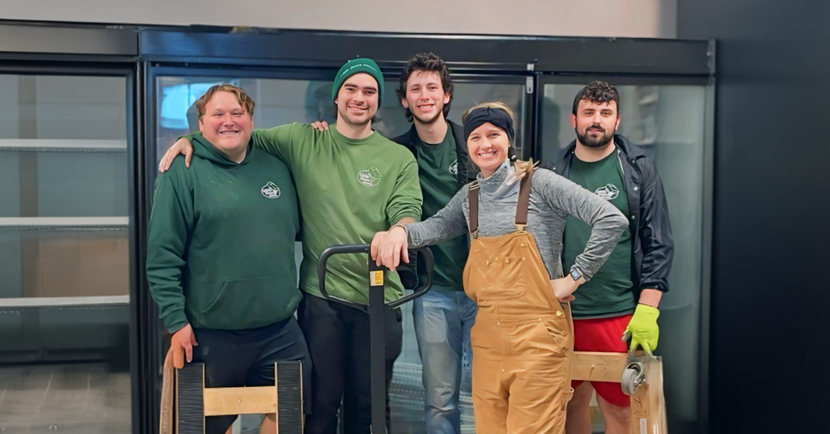 Little Guys Movers in Waco moves a large commercial fridge for a local Waco business