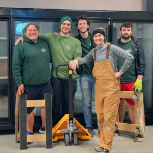 Little Guys Movers in Waco moves a large commercial fridge for a local Waco business