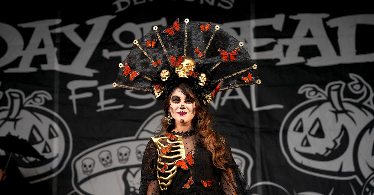 Woman dressed in Dia de los Muertos regalia