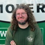 Mover Seth in front of a moving truck