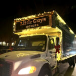 Little Guys Movers' moving truck is strung with warm white Christmas lights, ready for the Lights of the Ozarks parade around the Fayetteville downtown square.